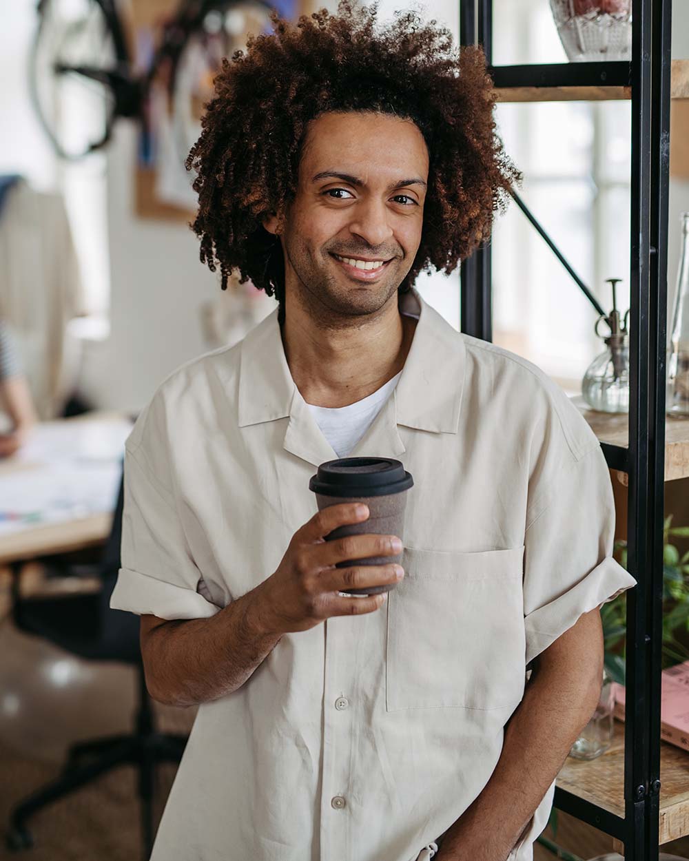 portrait-of-young-multiracial-man-in-office-DBXGRPQ.jpg